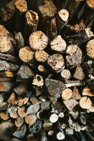 Top view of Pile of dried and burnt wood fire logs for fire camp in the Akha village of Maejantai on...