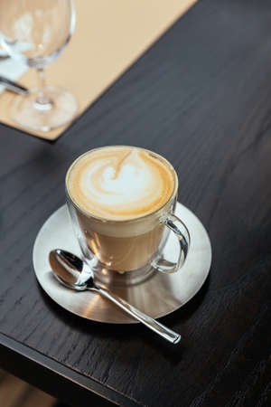 Top view of Hot Cappucino with blur green background. White froth on coffee and milk with copy space.の写真素材