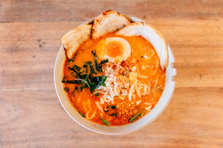 Top view of Spicy Chashu Miso Ramen: Japanese noodle in vegetable broth mix Miso paste with Chashu pork, sprouts, minced pork, seaweed and half boiled egg.の写真素材