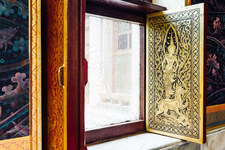 Golden Thai angel decorated on window inside Thai Monastery at Bodh Gaya, Bihar, India.