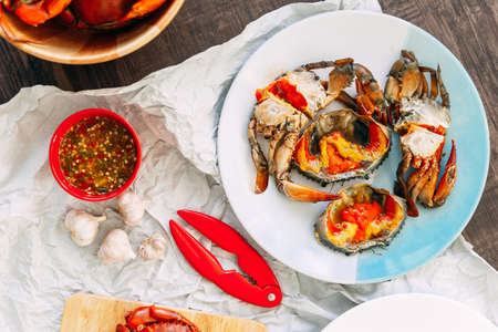 Fish Sauce-Fermented Sea Crab and Pickled Crab Eggs served with Thai style spicy seafood sauce.の写真素材