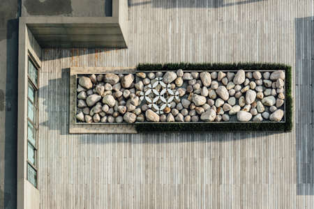 Top view of platform filled with stone on wooden rooftop. Architectural Decoration, Outdoor...