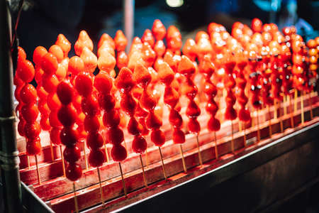 Strawberry sugar coated skewers. Street food of Jiantan in Taipei, Taiwan.の写真素材