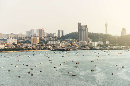 Panorama of Cityscape with construction buildings and Seascape with boats, bright sky and cloud of...