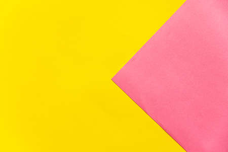 Yellow and pink paper background. Abstract background. Colorful background with copy space.の写真素材