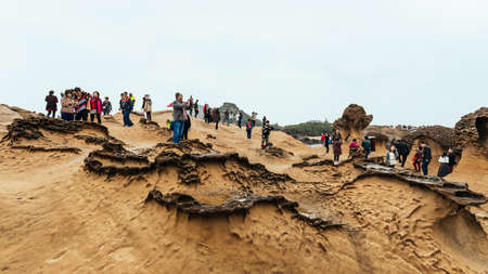 Diversity of tourists walking in Yehliu Geopark, a cape on the north coast of Taiwan. A landscape of...