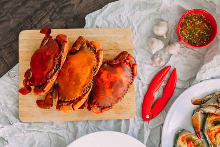 Top view of Steamed Giant Mud Crabs served with Thai style spicy seafood sauce and garlic.の写真素材