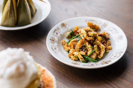 Stir Fried Spicy Crispy Pork Skin with Acaci. Classic Thai cuisine.