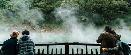 Tourist travel in the famous Beitou Thermal Valley in Beitou Park, boiling steam from hot spring floating through the trees in Taipei City, Taiwan.のeditorial素材