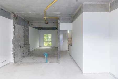 Construction site of empty Interior space, unfinished building after demolition process. Home improvement and renovation business.の写真素材