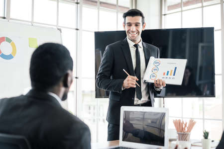 Business group meetings and corporate discussions about year review and a new business plan in the...