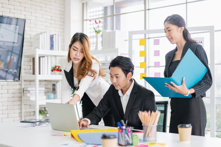 Professional Asian business adviser meeting to analyze and discuss the strategy of financial support of a tech company. Partnership start-up consultant, Indoor business client consultation concept.の写真素材