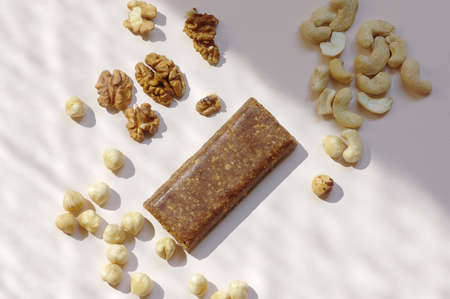 Healthy food granola bar with nuts on white background