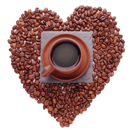 Coffe beans in the shape of a big heart, isolated on white backgroundの写真素材