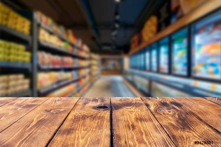 Empty wooden table and blur interior background, product display,blurred light background with bokeh,Ready for product montage,cafe and restaurantの写真素材