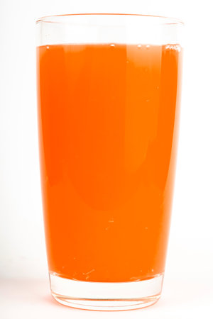 glass cup of tomato red juice isolated on white backgroundの写真素材