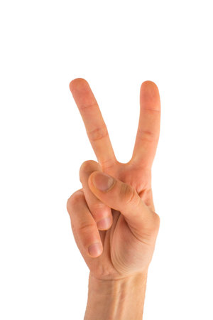 Man's hand showing victory sign. isolated on a white background.の写真素材