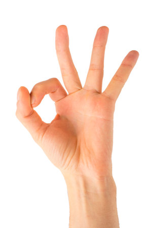 Woman hand in ok sign on a white isolated backgroundの写真素材