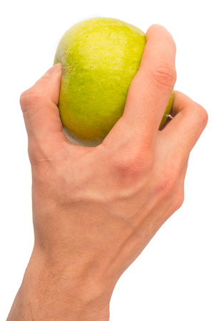 in a hand a green apple isolated on white isolated backgroundの写真素材