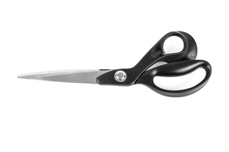 Pair of tailor scissors with black handle isolated on white backgroundの写真素材