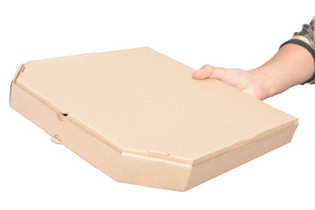 Hand holding a cardboard box isolated on white background with clipping path.の写真素材