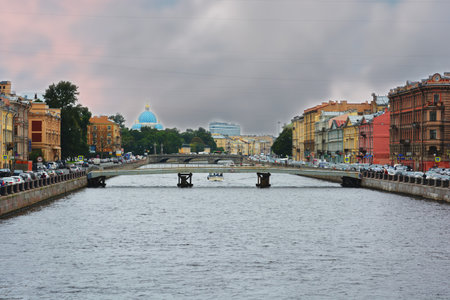 Scenic sunset cityscape over Arno River, St Trinity Bridge and colorful old houses along the river in cityの写真素材