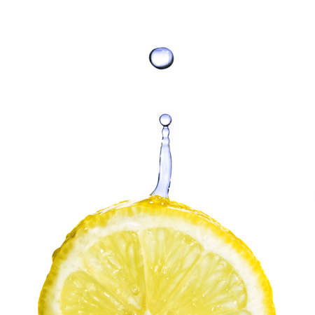 fresh water drop on lemon isolated on whiteの写真素材