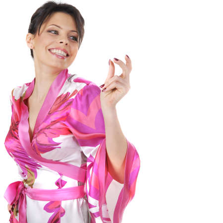 Smiling girl in kimono dancing isolated on whiteの写真素材