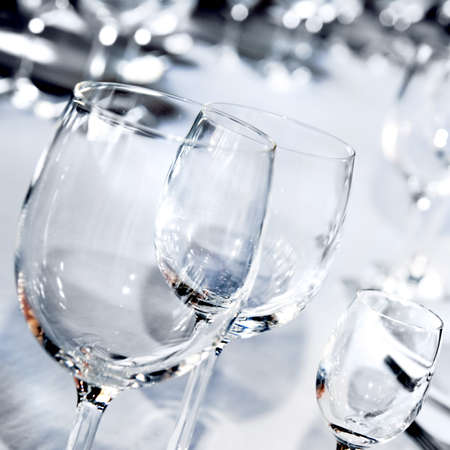 Three glass goblets on white tableの写真素材