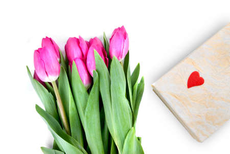 close-up pink tulips with gift isolated on whiteの写真素材