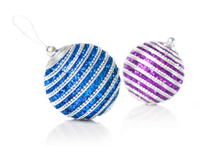 pink and blue christmas balls isolated on whiteの写真素材