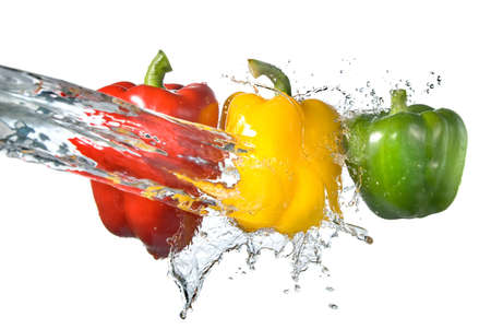 red, yellow and green pepper with water splash isolated on whiteの写真素材
