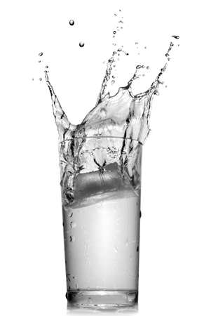 water splash in glass isolated on whiteの写真素材