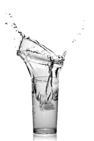 water splash in glass isolated on whiteの写真素材