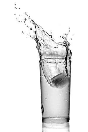 water splash in glass isolated on whiteの写真素材