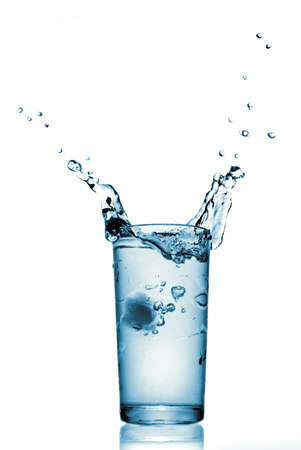 water splash in glass isolated on whiteの写真素材