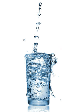 water splash in glass isolated on whiteの写真素材
