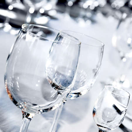 Three glass goblets on white tableの写真素材