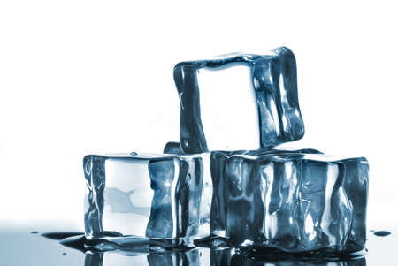 ice cubes with water drops on whiteの写真素材
