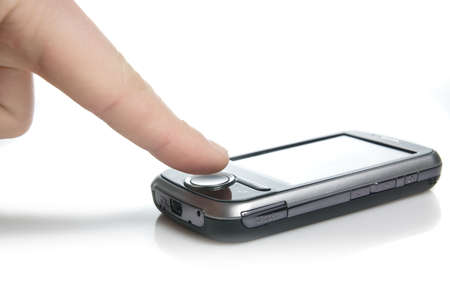 finger and pda with touch screen isolated on whiteの写真素材