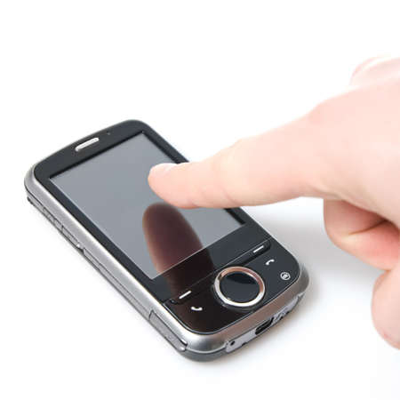 finger and pda with touch screen isolated on whiteの写真素材
