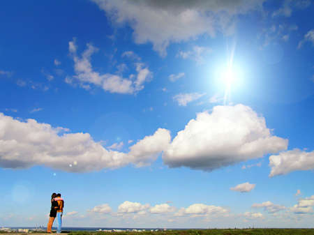 couple against blue skyの写真素材