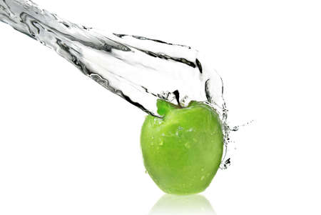 fresh water splash on green apple isolated on whiteの写真素材