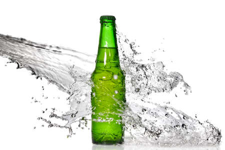 Green beer bottle with water splash isolated on whiteの写真素材