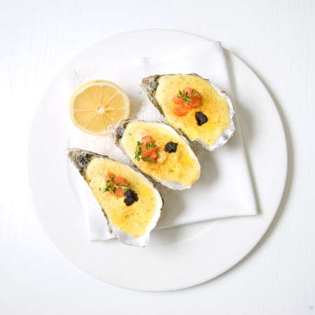 oysters with sauce and lemonの写真素材