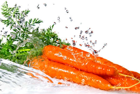fresh water splash on red pepper isolated on whiteの写真素材