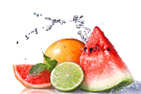 Water splash on  fresh fruits isolated on whiteの写真素材