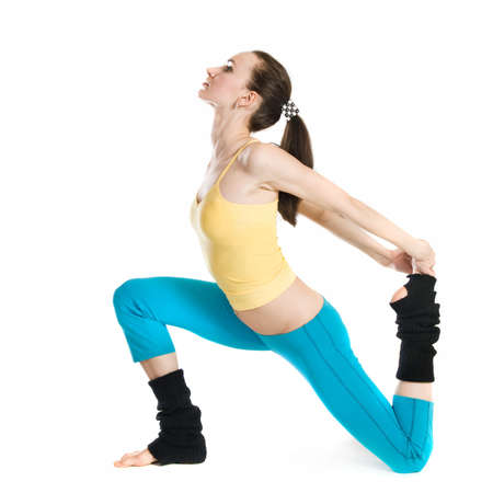 beautiful girl doing gymnastics on white backgroundの写真素材