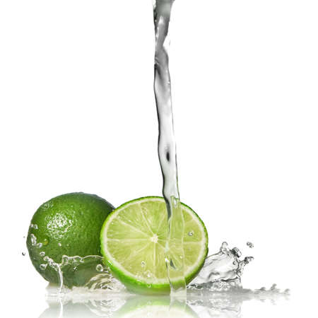 Water splash on lime isolated on whiteの写真素材