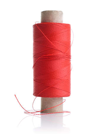 red thread and coil isolated on white